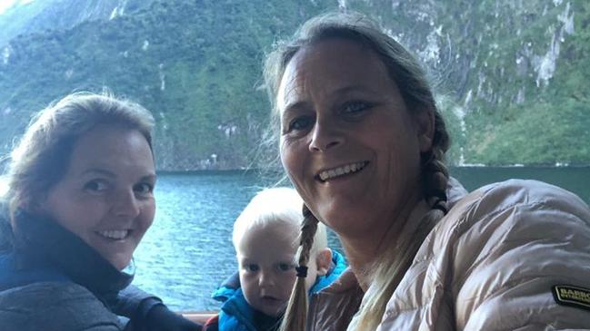 Elle Kelly, left, with her wife and their son Vinnie at Milford Sound in New Zealand.