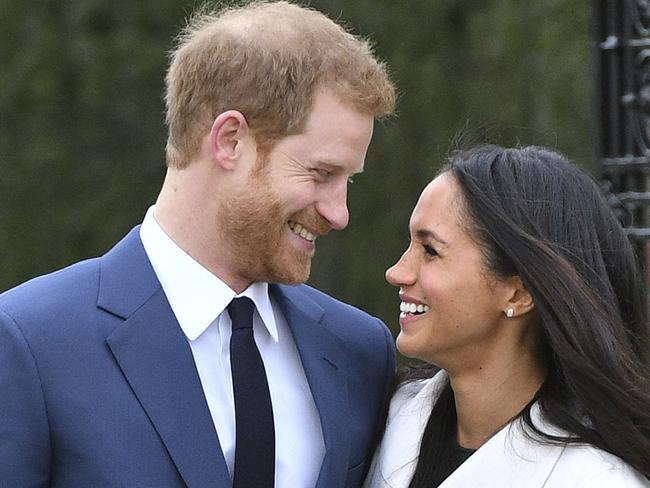 Prince Harry and Meghan Markle smile after their engagement announcement. Picture: Dominic Lipinski/PA via AP