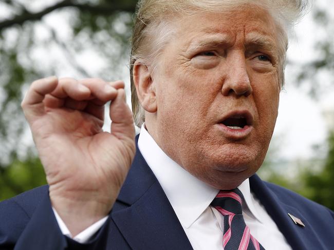 President Donald Trump speaks to members of the media on the South Lawn of the White House in Washington, Tuesday, May 5, 2020, before boarding Marine One for a short trip to Andrews Air Force Base, Md., and then on to Phoenix, Ariz. (AP Photo/Patrick Semansky)