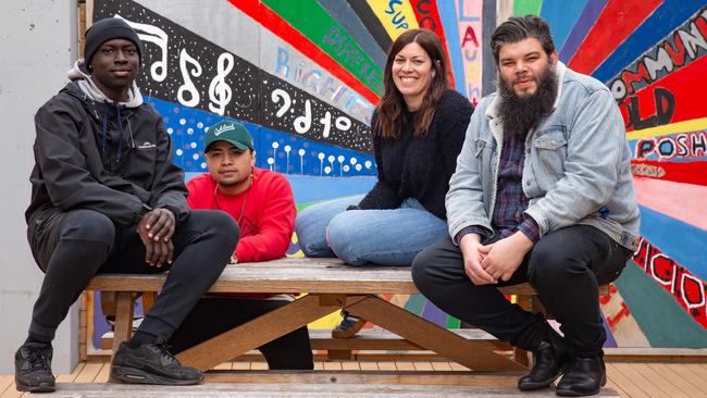 St Joseph's Flexible Learning is the biggest grower in enrolment over the past five years across inner Melbourne. Students Majok Majok and TJ Moon with youth worker Ali Mortimer and campus principal Michael Crowe. Picture: Sarah Matray