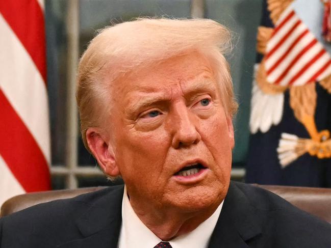 US President Donald Trump speaks to journalists about TikTok as he signs executive orders in the Oval Office of the White House in Washington, DC, on January 20, 2025. (Photo by Jim WATSON / POOL / AFP)