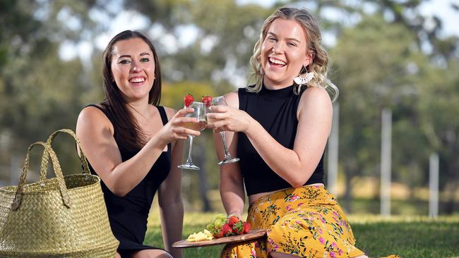 Polly Humphries, 20, and Emilee Cooper, 20, having fun as singles in Bedford Park. Picture: Tom Huntley