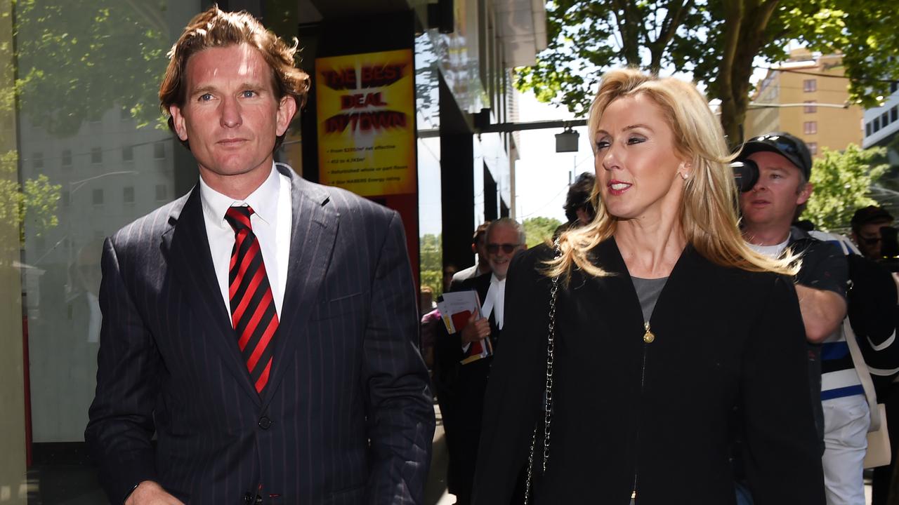 Essendon AFL coach James Hird (left) and wife Tania (right) leave at the Federal Court in Melbourne, Tuesday, Nov. 11, 2014. James Hird is appealing against the court ruling that ASADA's Essendon supplements program investigation was lawful. (AAP Image/Tracey Nearmy) NO ARCHIVING