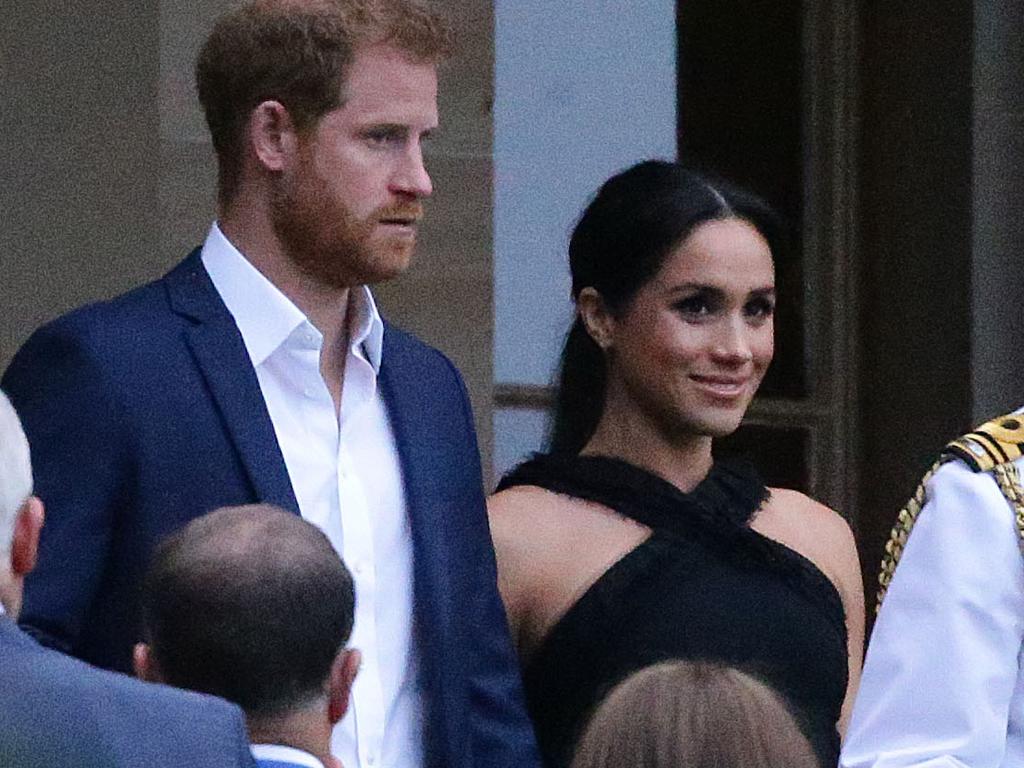 Meghan looked glamorous in a black dress as she and husband Prince Harry attended an evening reception at Government House. Picture: Matrix