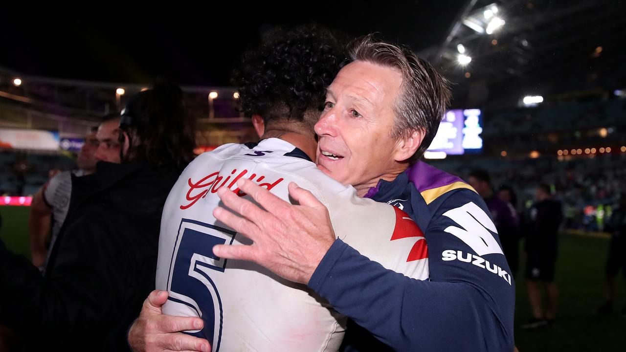 SYDNEY, AUSTRALIA - OCTOBER 25: Storm coach Craig Bellamy and Josh Addo-Carr of the Storm embrace after winning the during the 2020 NRL Grand Final match between the Penrith Panthers and the Melbourne Storm at ANZ Stadium on October 25, 2020 in Sydney, Australia. (Photo by Cameron Spencer/Getty Images)