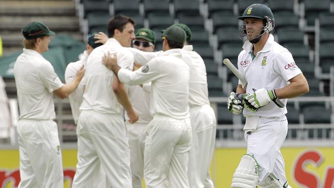 Pat Cummins celebrates the key wicket of South Africa’s AB de Villiers.