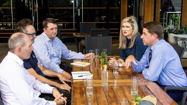 Planning minister Cameron Dick, alongside Labor candidate for Petrie Corinne Mulholland, meets with members of Save North Lakes Golf Course.