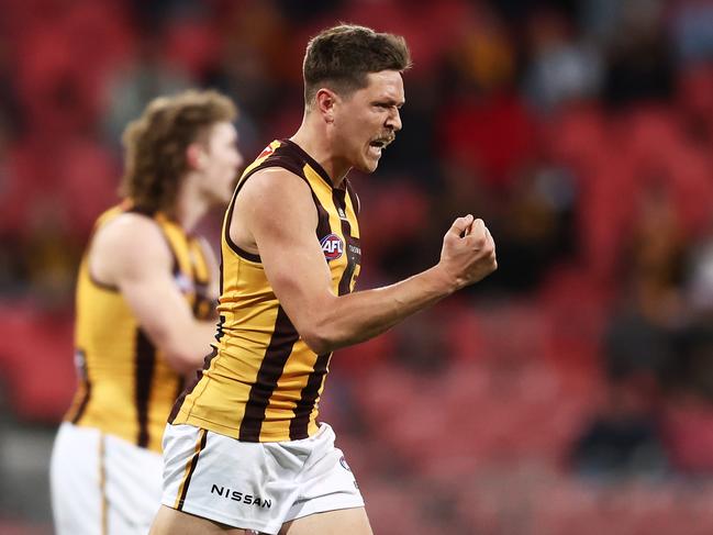 Fergus Greene of the Hawks celebrates with teammates after kicking a goal during the round 17 AFL match against Greater Western Sydney Giants on July 08, 2023, in Sydney. Picture: Matt King.