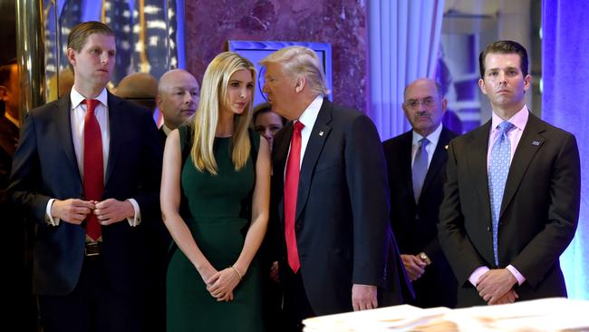 Donald Trump along with his children Eric (L) Ivanka and Donald Jr. (R) arrive for a press conference at Trump Tower in New York.