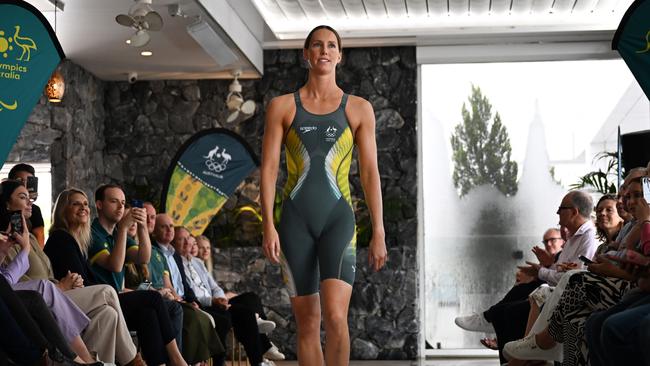 McKeon showing the uniform Australian swimmers will wear in Paris. Picture: Dan Peled/NCA NewsWire