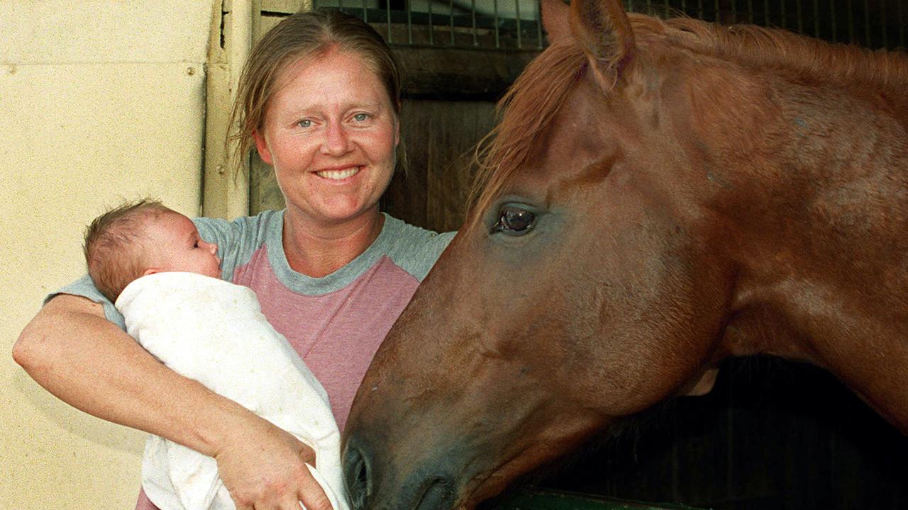 OCTOBER 8, 2002 : Trainer Sonja Kumpikas with newborn daughter Heiki & racehorse Grand Lover 08/10/02. Pic Barry Pascoe. Turf