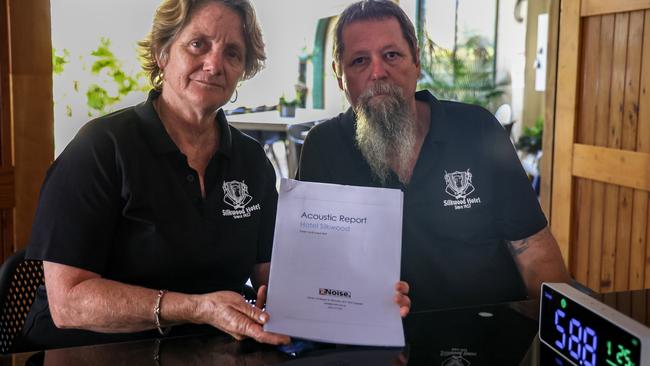 Silkwood Hotel owners Cassie and Paul Grover review an acoustic report they will be submitting to the Office of Liquor and Gaming Regulation in order to host live music exceeding 75 decibels. Picture: Arun Singh Mann