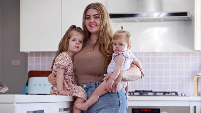 Nurse Emily Parker, pictured with daughters Aria (left) and Aura, has a HECS debt of $28,000 and rising. Picture: Sam Ruttyn