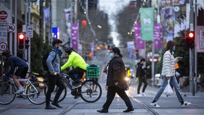 City life: Swanston Street in Melbourne’s CBD on Wednesday, ahead of mandatory mask-wearing regulations coming in to force. Picture: Daniel Pockett