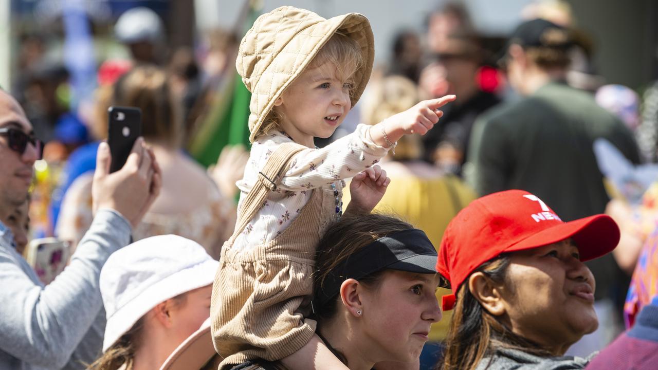 Rowan Covington gets a good view on the shoulders of Tiffany Lane at the Grand Central Floral Parade of Carnival of Flowers 2022, Saturday, September 17, 2022. Picture: Kevin Farmer