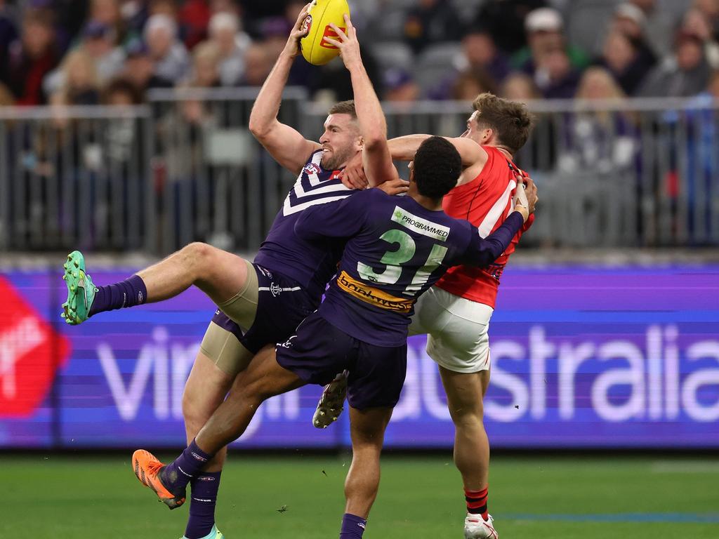 Luke Ryan backs into a pack to mark for the Dockers. Picture: Will Russell/AFL Photos via Getty Images