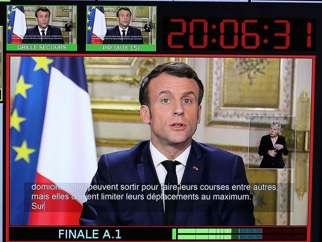 A screen broadcasting the declaration of France's President Emmanuel Macron, made from The Elysee Palace in Paris. Picture: AFP