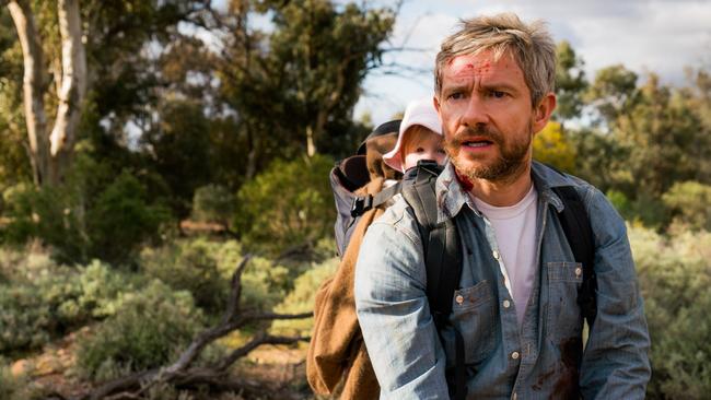 Martin Freeman with baby Rosie in a scene from Cargo.