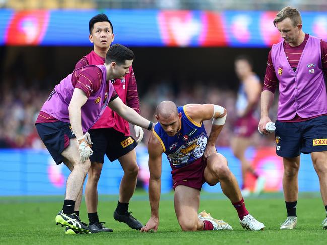 Brandon Starcevich is seen to by trainers after a collision with Izak Rankine. Picture: Chris Hyde/AFL Photos/via Getty Images.