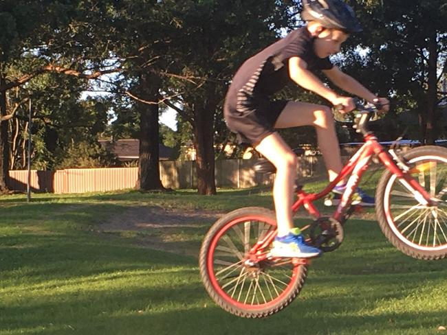 Tyler, aged 10, in action riding his bike at the Reserve