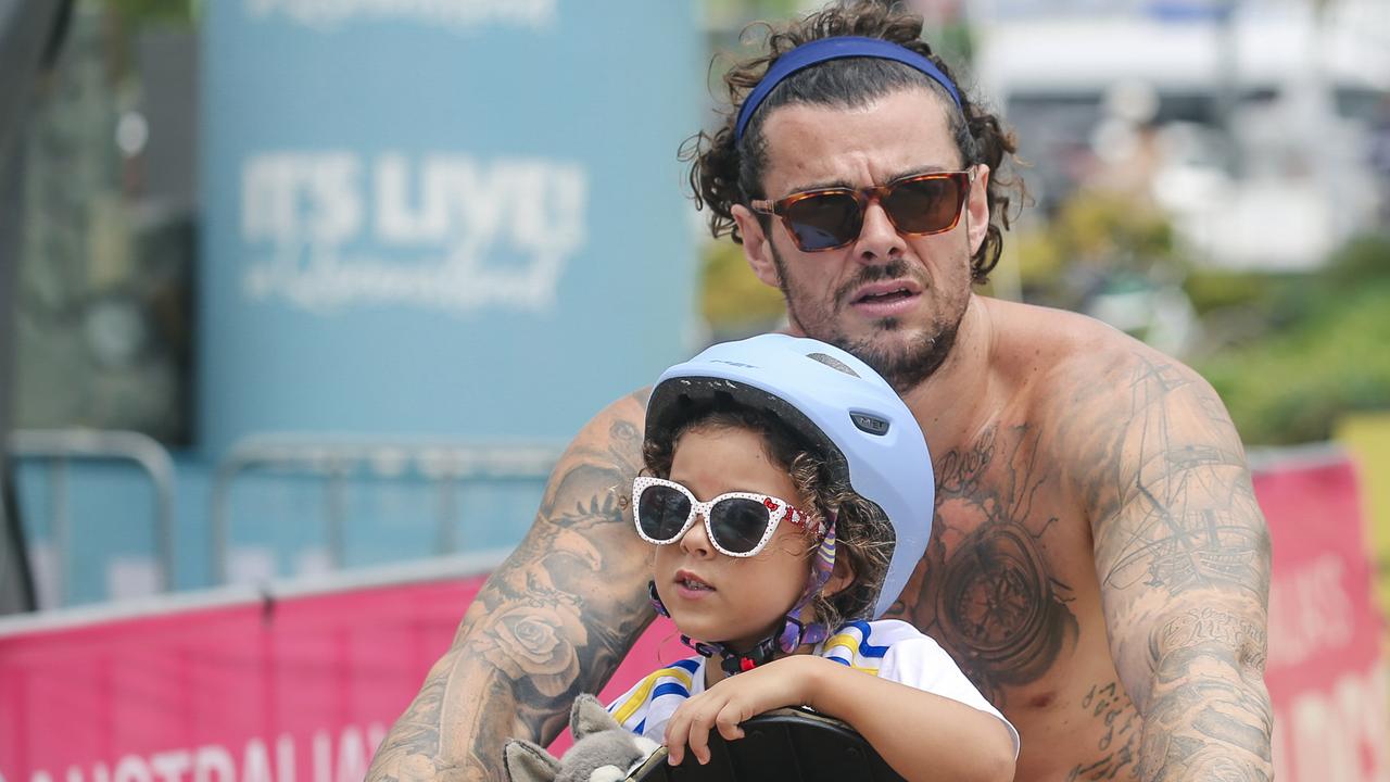 Indie Rose and Dad Ben Simpson among the crowd at the 2025 Gold Coast Open surf comp at Burleigh Heads. Picture: Glenn Campbell