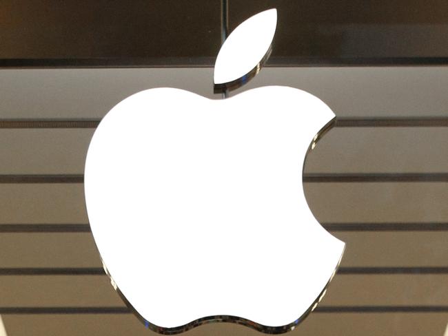 FILE - This Thursday, Sept. 19, 2013, file photo shows the Apple logo above a store location entrance in Dallas. Apple has bought Shazam, the maker of a song-recognition app that Apple's digital assistant Siri has already been using to help people identify the music playing on their iPhones. (AP Photo/Tony Gutierrez, File)