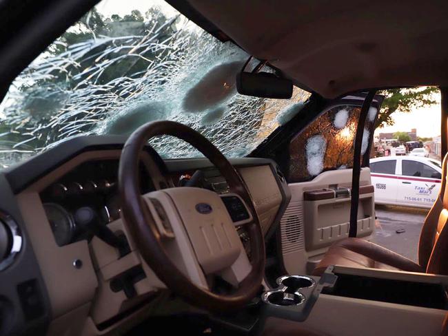 A bullet ridden vehicle in a street of Culiacan, state of Sinaloa, Mexico. Picture: AFP