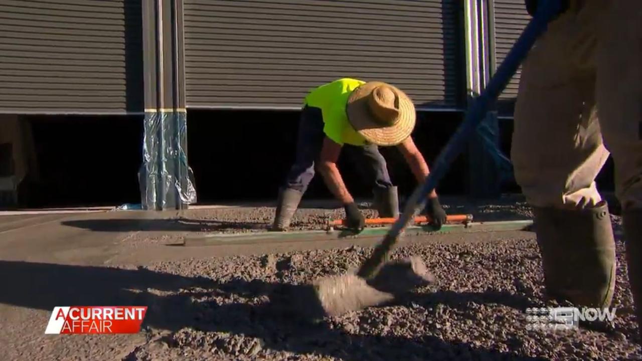 Steve spends most of his day hunched over levelling concrete. Picture: Nine