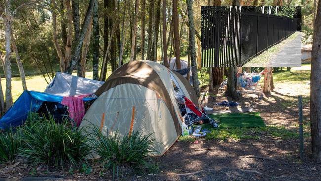 Homeless people camp behind the village and use the various facilities at the Community Village and the newly installed fence (inset).