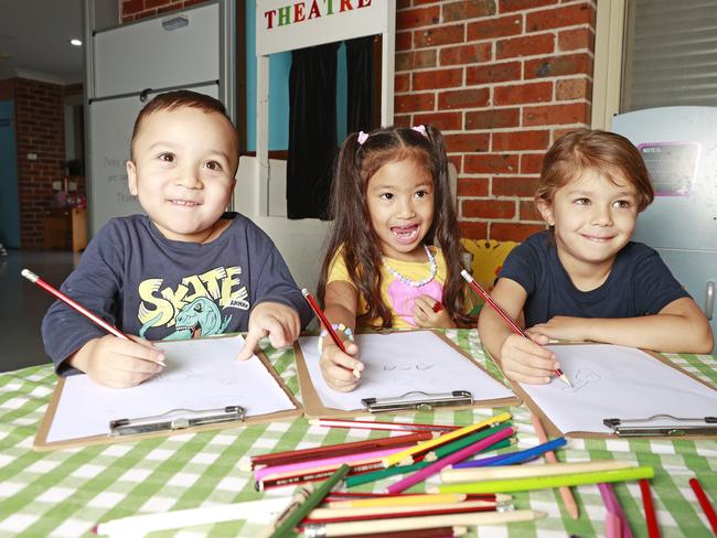 Four-year-old Zane, Janea and Aisha are among the “guinea pigs” trialling pre-Kindergarten at Connie's Child Care Centre in Mt Druitt. Picture: Tim Hunter