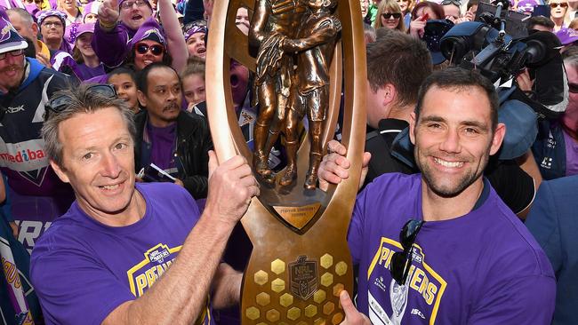 MELBOURNE, AUSTRALIA - OCTOBER 02: Cameron Smith and Craig Bellamy of the Storm hold up the NRL premiership trophy during the Melbourne Storm NRL Grand Final celebrations at Gosch's Paddock on October 2, 2017 in Melbourne, Australia. (Photo by Quinn Rooney/Getty Images)