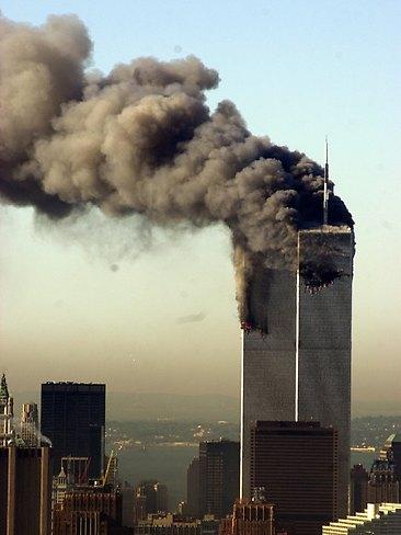 Smoke billows from the burning twin towers before they collapse, on September 11, 2001. AP