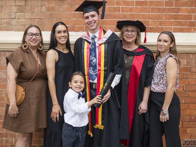 Masters of Psychology (Research) graduate Joshua Waters with family and friends (from left) Kerry Canning, Louarna Waters, Maayali Waters, academic supervisor Renee Desmarchelier and Rachel Waters at a UniSQ graduation ceremony at Empire Theatres, Wednesday, February 14, 2024. Picture: Kevin Farmer