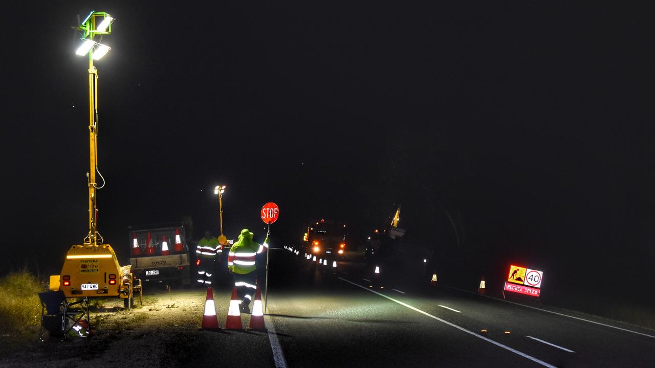 Traffic was forced to slow along the Warrego Highway as council contactors worked to clean up the spill late into the night. Picture: Peta McEachern