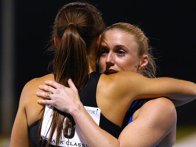 Sally Pearson is embraced by Brianna Beahan after winning the 100m hurdles.