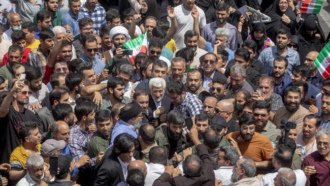 Saeed Jalili, Iran's presidential candidate and former ultra-conservative nuclear negotiator, surrounded by his supporters at a polling station on July 5, 2024 in Tehran. Picture: Getty
