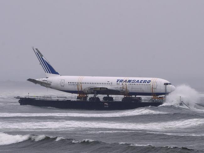 The waves crash around it. Picture: Reuters