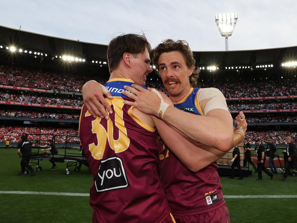 Eric Hipwood and Joe Daniher celebrate after Brisbane Lions win the AFL Grand Final, defeating the Sydney Swans at the MCG. Picture Lachie Millard