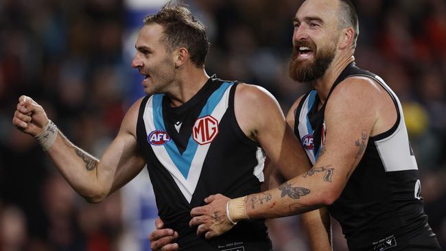 MELBOURNE , AUSTRALIA. April 5, 2024.  AFL Gather Round. Round 4.  Port Adelaide vs Essendon at the Adelaide Oval.   Jeremy Finlayson of the Power celebrates a 4th quarter goal with Charlie Dixon   . Pic: Michael Klein