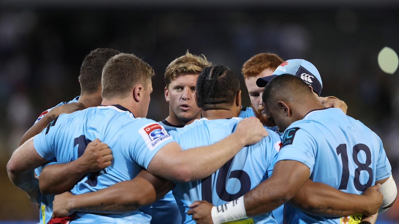 Damien Fitzpatrick of the Waratahs talks to his forward pack.