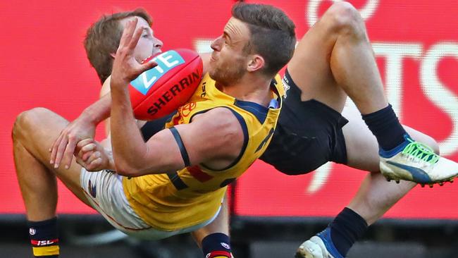 Hard at it ... Brodie Smith winst he ball ahead of Carlton’s Liam Sumner. Picture: Scott Barbour (AFL Media/Getty Images)