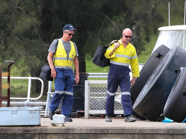 Svitzer staff walking back along the pier in Balmain. Picture: NCA Newswire / Gaye Gerard