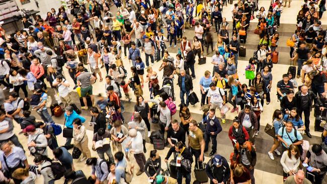 Crowds of people at Singapore’s Changi Airport.