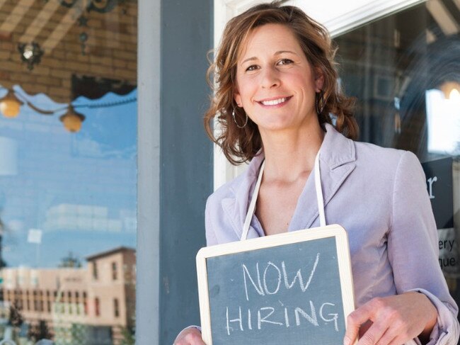 istock small business hiring sign woman