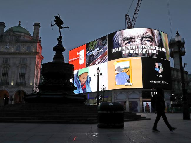 COVID-19 messaging is seen on the advertising hoarding at London’s Piccadilly Circus during the UK's third national lockdown. Picture: Getty Images