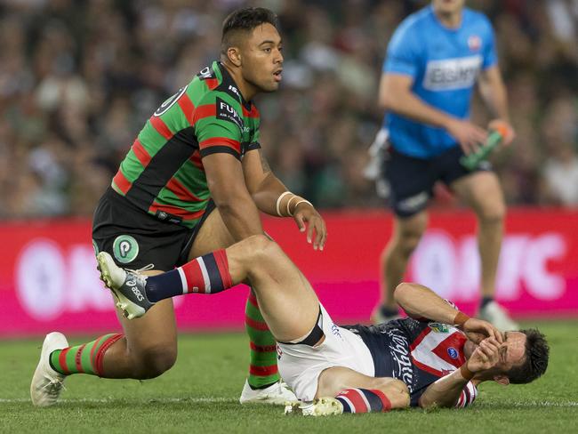 Cooper Cronk is smashed late by Tevita Tatola. Picture: AAP