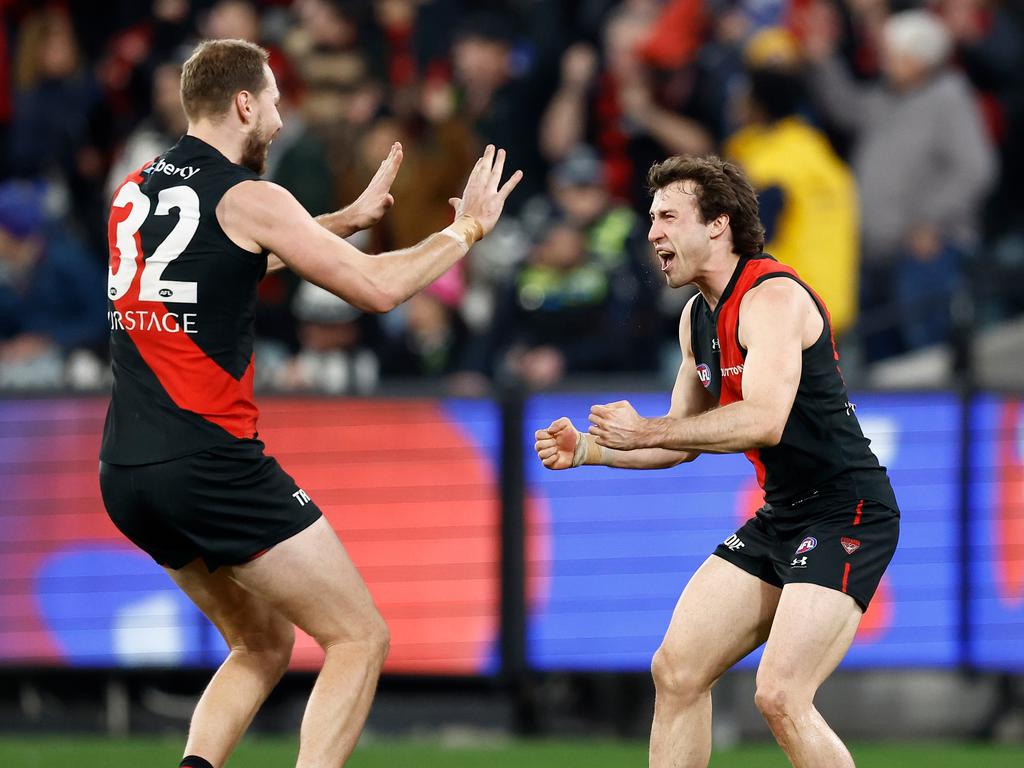 MELBOURNE, AUSTRALIA - JULY 05: Ben McKay (left) and Andrew McGrath of the Bombers celebrate during the 2024 AFL Round 17 match between the Collingwood Magpies and the Essendon Bombers at Melbourne Cricket Ground on July 05, 2024 in Melbourne, Australia. (Photo by Michael Willson/AFL Photos via Getty Images)