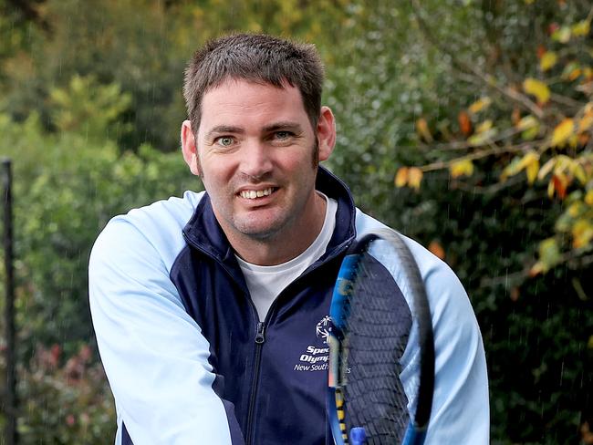 SMARTdaily - 11 MAY, 2022. NATIONAL HIREUP STORY. People with a disability can connect with their community through sport. Support worker Patrick Neary (L) plays tennis with Ben Hayman has a moderate intellectual and physical disability and connects with him through playing tennis together. Picture: Toby Zerna