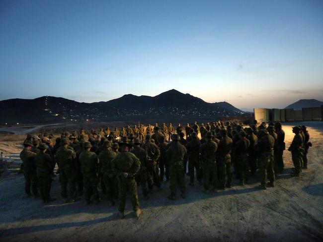 As the sun rose over the Hindu Kush mountains in eastern Afghanistan at Camp Qargha on the outskirts of Kabul, soldiers from 3RAR gathered to remember former members of the battalion, 100 years after the guns fell silent on the Western Front. Picture Gary Ramage