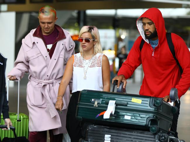 The singer with crew members after arriving in Sydney. Picture: Matrix